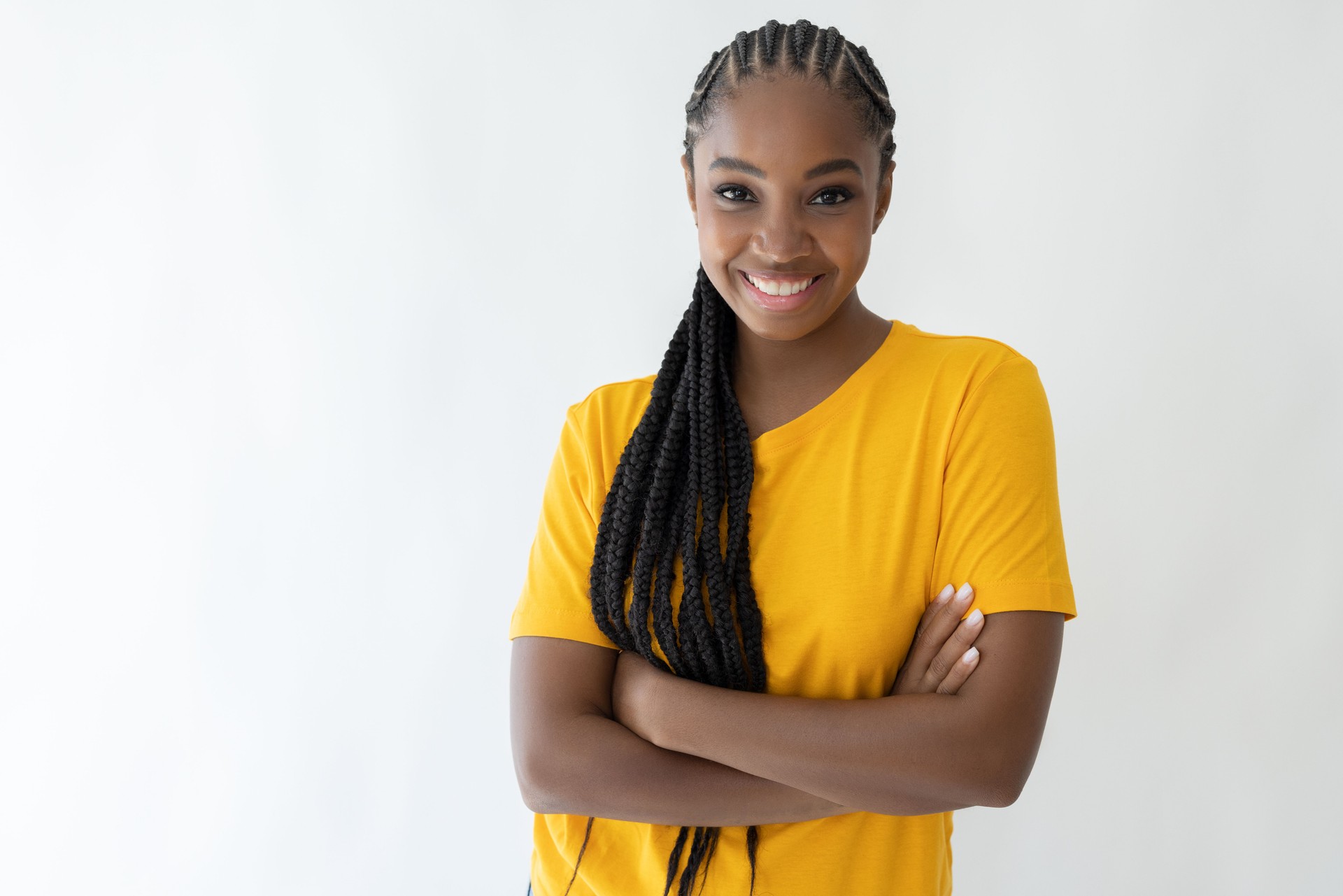African woman standing with arms crossed